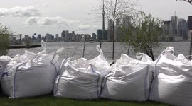 Thousands of sandbags placed on the shores of Toronto waterfront islands to protect from flooding as lake Ontario water levels rise to near historic levels