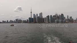 Piles of sandbags line the waterfront at Toronto islands to protect against flooding as water levels rise on lake Ontario