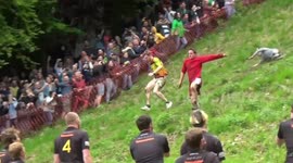 Daredevils run down Cooper's Hill for Gloucestershire cheese rolling race