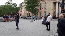 Megaphone man heckles Christian preachers in Trafalgar Square