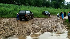 Jeeps Loaded Onto Raft To Cross River