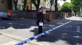 Blood stains the pavement after man fatally stabbed in east London