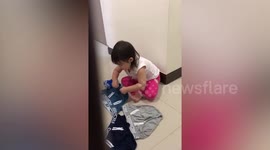 Adorable little girl secretly helps with the laundry