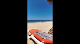 A new meaning to riding the waves! Crazy cyclist in Portugal pedaling through the waves