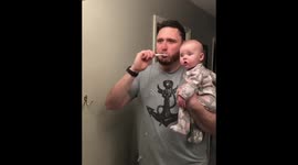 Baby has hilarious reaction to her dad brushing his teeth