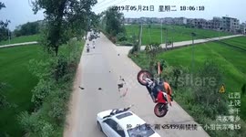 Motorcycle flips through the air after head-on car crash, throwing rider onto bonnet