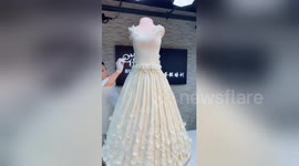 Chinese baker sculptures giant cake into amazing wedding dress