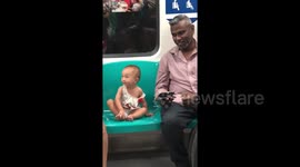 Heartwarming moment man and little girl watch 'Tom & Jerry' on train in Singapore