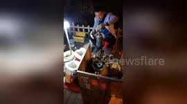 Chinese vendor uses traditional cooking technique to make popcorn