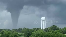 Watch the harrowing moment a huge tornado vortex threatens a water tower in Mabank, Texas