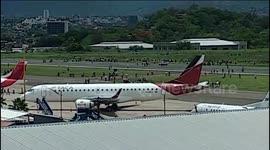 Hundreds forced to flee Honduras international airport as police use tear gas on protesters