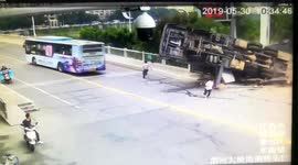 Men escape death after large crane flips over in China’s Jiangxi