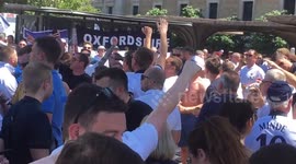 Excited Tottenham fans cheering to his team in Madrid
