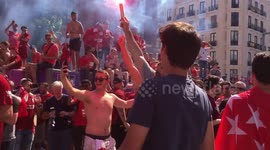 Excited Liverpool fans cheering to his team in Madrid