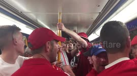Liverpool fan in good voice singing their songs on Metro on way to Champions League Final