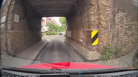 Learner driver, driving at 20 mph in a 20 zone clearly seen on video, is being overtaken by A RED Driving school car breaking the speed limit over humps, disappearing in the distance.