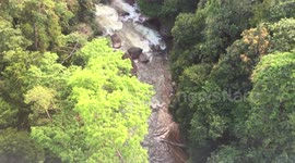 Waterfall or Water Stream In a Valley