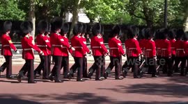 Guardsmen march along the Mall to brass band for Colonels review of Trooping the Colour 2019 on 1 June
