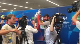Liverpool hero runs round with Champions League trophy aloft