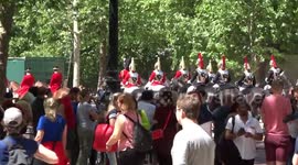 Crowds are watching cavalry in the Mall after Colonels review of Trooping the Colour on 1 June 2019