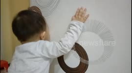 Baby Kissing Wallpaper's Black Circle