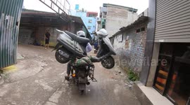 Crazy moments! a motorbike carrying a bulky motorbike on the street