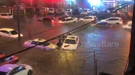 Vehicles submerged in deep water after heavy rainstorm causes floods in China