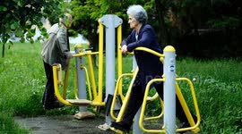 weekend walk and gym in the park for an old couple