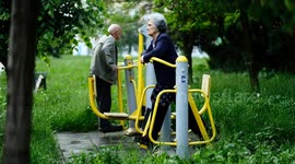 weekend walk and gym in the park for an old couple