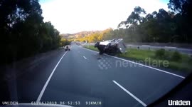 Flipping hell! Dashcam captures truck rolling into oncoming traffic in Australia