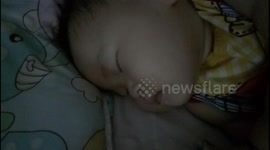 Cute chubby baby in sweet dreams