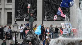 Anti-Trump protesters gather outside London's Trafalgar Square