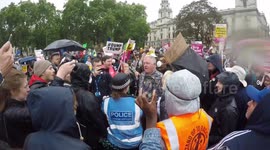 Trump supporter MILKSHAKED as protesters shout 'Nazi scum' at London protest