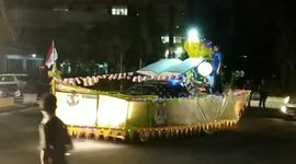Parade of cars decorated with giant ornaments drive through Indonesian city for Eid al-Fitr