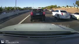 Biker does Wheelie while splitting lanes in HOV Lane in Tempe Arizona during Arizona Bike Week.