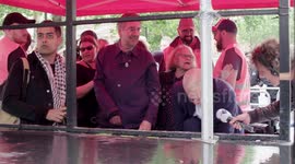 Corbyn ties shoe lace backstage as he prepares for anti-Trump speech