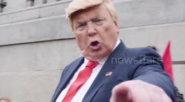 Trump impersonator pouts at camera during London protest