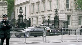 Anti-Trump protesters boo as president's armour-plated Beast car leaves Downing Street