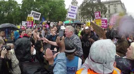 Slow-mo footage showing Trump supporter being milkshaked after being surrounded by protesters