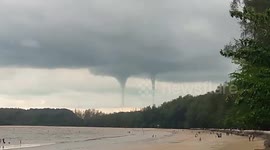 Rare double waterspout amazes beachgoers in southern Thailand
