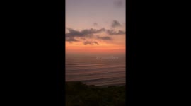 'Paradise and hell' Gorgeous sunset opposite colossal traffic jam filmed in Peru