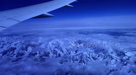 Traveler films Canada’s icy mountains from plane window