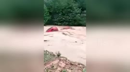 Flash floods sweep vehicles away in China after heavy rainstorm