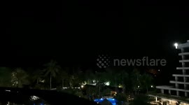 Night sky fork lightning over the beach