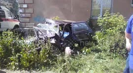 Aftermath of fatal crash shows car crumpled against wall northeast of Moscow