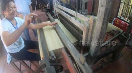 Unique 100-year-old rudimentary fabric weaving machine is made entirely from wood in Vietnam! It works completely by human power.