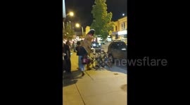 Man in dinosaur costume celebrates Raptors NBA win