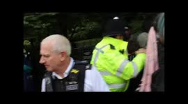 Police hold back Proteserts with CS Spray