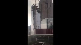 High winds blow out windows of skyscraper under construction in Dallas