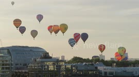 Fleet of hot air balloons rise above London for charity event